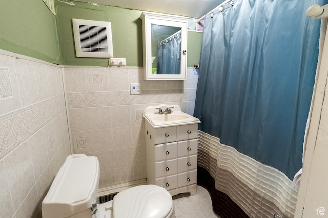 3219 Pingree Ave, Ogden, UT 84401 - bathroom featuring toilet, tile walls, vanity, tile patterned floors, and curtained shower