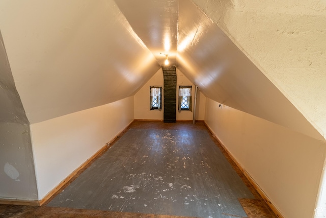3219 Pingree Ave, Ogden, UT 84401 - additional living space featuring lofted ceiling, baseboards, and wood finished floors