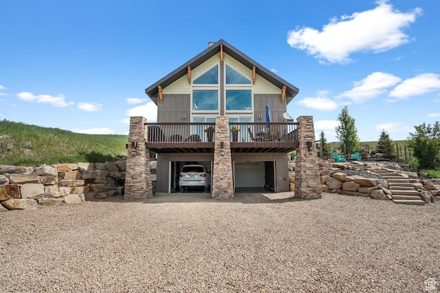 359 Parkview Rd, Coalville, UT 84017 - rear view of house with a carport, gravel driveway, and a wooden deck