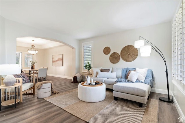1784 E Ellerbeck Ln, Draper, UT 84020 - living room featuring arched walkways, wood finished floors, and baseboards