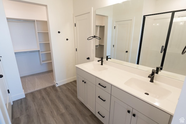 336 W Rosie Loop Unit 45W, Cedar City, UT 84721 - full bathroom featuring a spacious closet, wood finished floors, a stall shower, and double vanity