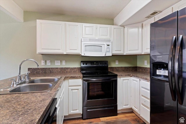 502 E 475 N, Ogden, UT 84404 - kitchen featuring black appliances, a sink, white cabinetry, and wood finished floors