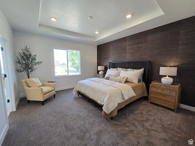 4286 W 1600 S Unit 301, Ogden, UT 84404 - bedroom featuring dark colored carpet, recessed lighting, a tray ceiling, and a textured ceiling