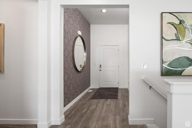 4286 W 1600 S Unit 301, Ogden, UT 84404 - entrance foyer featuring wallpapered walls, baseboards, and wood finished floors