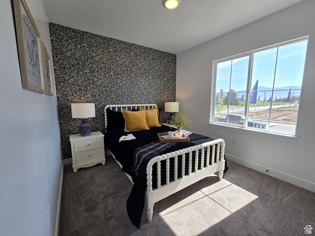 4286 W 1600 S Unit 301, Ogden, UT 84404 - carpeted bedroom with an accent wall and wallpapered walls