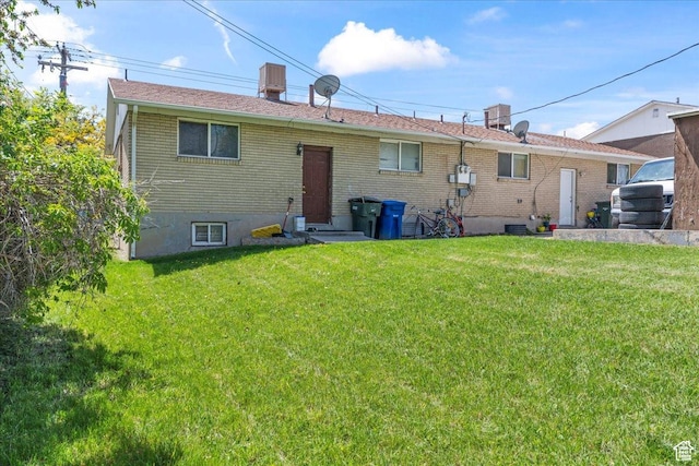 3230 W 4700 S, Salt Lake City, UT 84128 - back of house featuring a lawn