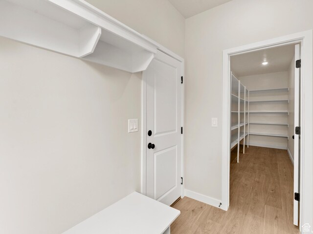 1597 N Cozy Ln Unit 14, Saratoga Springs, UT 84045 - mudroom featuring light wood-style floors and baseboards