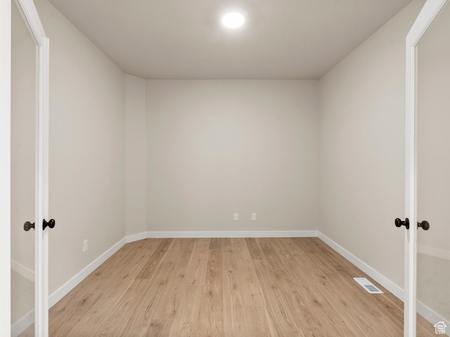 1597 N Cozy Ln Unit 14, Saratoga Springs, UT 84045 - empty room with french doors and light wood-style flooring