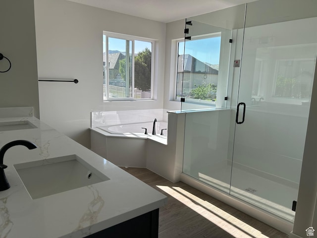 1597 N Cozy Ln Unit 14, Saratoga Springs, UT 84045 - full bathroom featuring double vanity, a bath, wood finished floors, and a shower stall