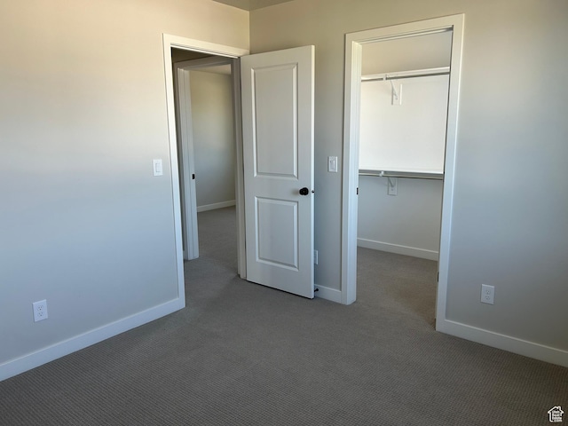 1597 N Cozy Ln Unit 14, Saratoga Springs, UT 84045 - unfurnished bedroom with carpet floors, baseboards, a closet, and a spacious closet