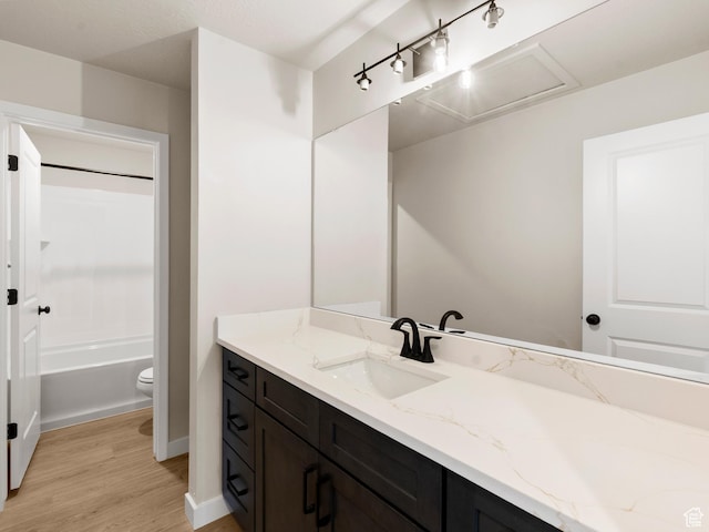 1597 N Cozy Ln Unit 14, Saratoga Springs, UT 84045 - bathroom with vanity, wood finished floors, and shower / washtub combination