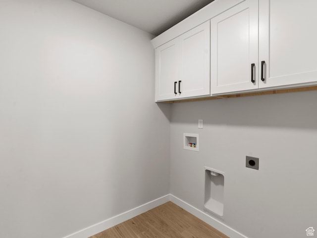 1597 N Cozy Ln Unit 14, Saratoga Springs, UT 84045 - laundry area with hookup for an electric dryer, cabinet space, light wood-style floors, and washer hookup