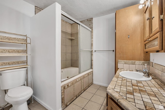 155 E 3185 S, South Salt Lake, UT 84115 - full bath with toilet, tile patterned flooring, vanity, tiled shower / bath, and baseboards