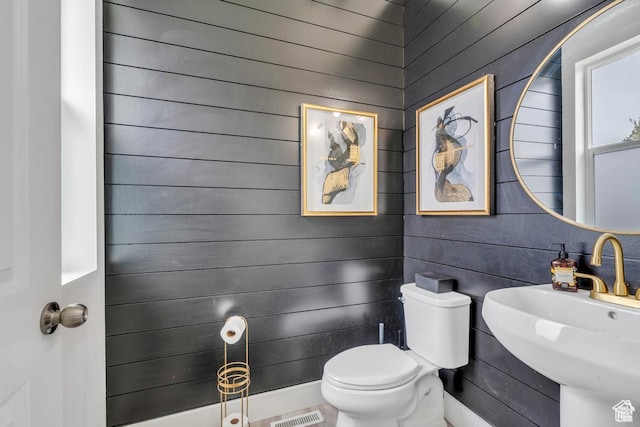 873 S Sunflower Ln W, Mapleton, UT 84664 - bathroom with toilet, a sink, and wooden walls