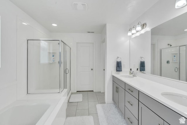 873 S Sunflower Ln W, Mapleton, UT 84664 - full bathroom with a stall shower, double vanity, tile patterned floors, a garden tub, and recessed lighting