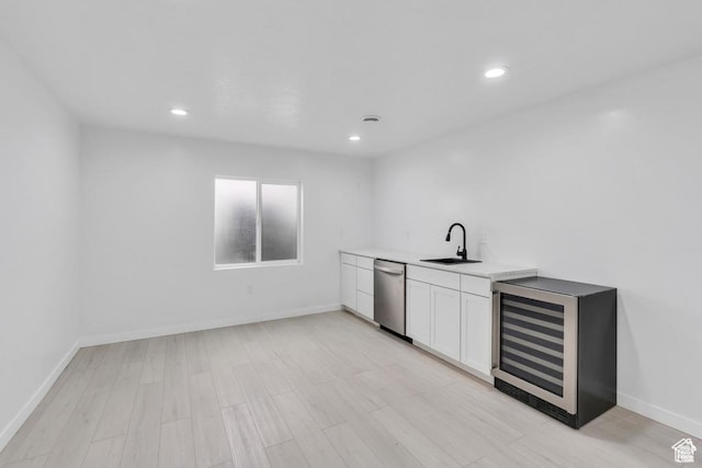 873 S Sunflower Ln W, Mapleton, UT 84664 - bar area with a sink, stainless steel dishwasher, wine cooler, light wood finished floors, and recessed lighting