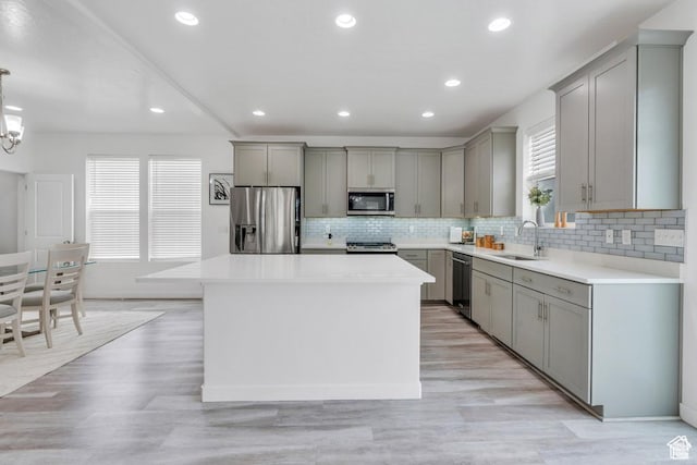 873 S Sunflower Ln W, Mapleton, UT 84664 - kitchen with stainless steel appliances, gray cabinetry, a sink, plenty of natural light, and recessed lighting