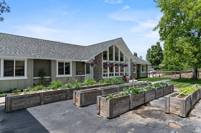 383 N 835 E, Lindon, UT 84042 - back of house featuring a vegetable garden, roof with shingles, and board and batten siding