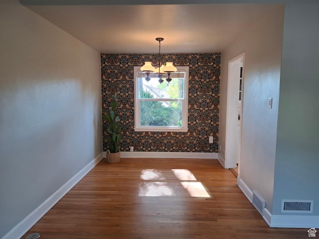 1130 S 1300 E, Salt Lake City, UT 84105 - unfurnished dining area featuring a chandelier and wood finished floors