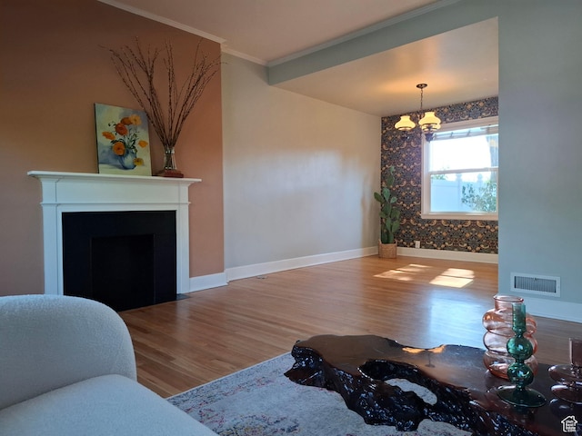 1130 S 1300 E, Salt Lake City, UT 84105 - living room featuring a chandelier, wood finished floors, ornamental molding, and a fireplace