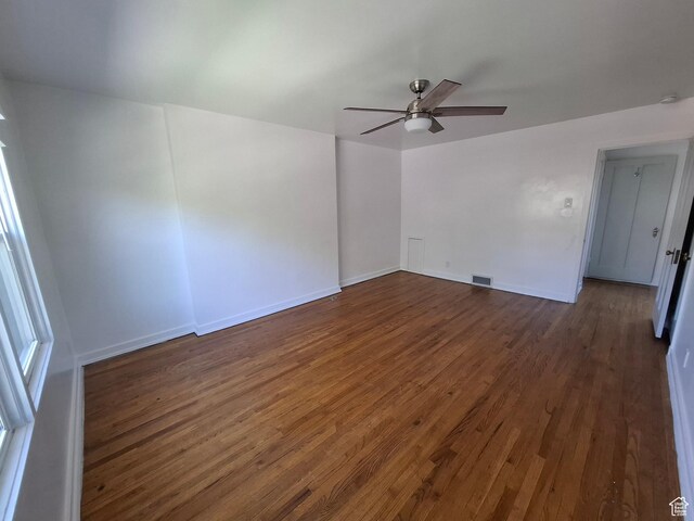 1130 S 1300 E, Salt Lake City, UT 84105 - empty room with dark wood-style floors, a ceiling fan, and a smoke detector
