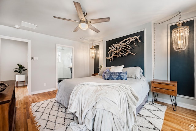 1130 S 1300 E, Salt Lake City, UT 84105 - bedroom featuring light wood-style floors, ceiling fan, and a chandelier