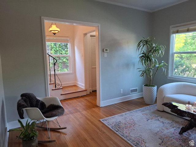 1130 S 1300 E, Salt Lake City, UT 84105 - sitting room featuring healthy amount of natural light, light wood-style flooring, and crown molding