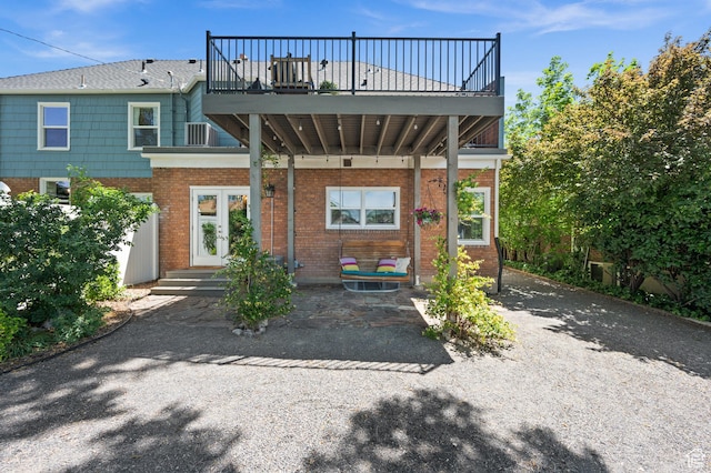 1130 S 1300 E, Salt Lake City, UT 84105 - back of property featuring brick siding and a balcony