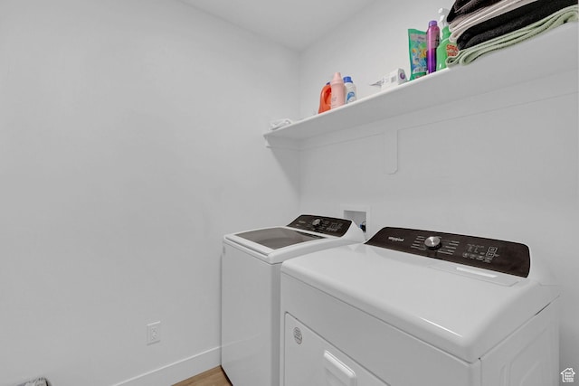 1230 W 1820 S, Logan, UT 84321 - washroom featuring washer and clothes dryer, baseboards, and light wood-style flooring