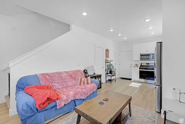 1230 W 1820 S, Logan, UT 84321 - living area featuring light wood-style floors and recessed lighting