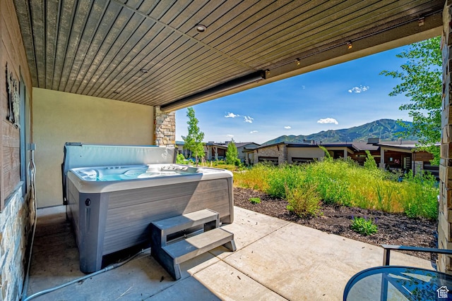 11517 N Perspective Dr, Hideout, UT 84036 - view of patio featuring a hot tub and a mountain view