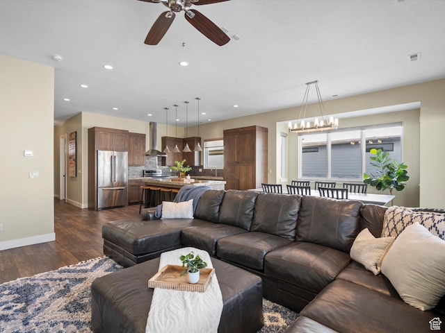5943 E Big Horn Pkwy, Eden, UT 84310 - living area with dark wood-style floors, a chandelier, a ceiling fan, baseboards, and recessed lighting