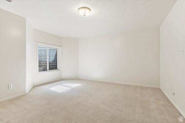 7825 S Spruce Tree Ln, Sandy, UT 84094 - unfurnished room featuring light carpet and baseboards