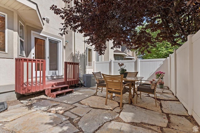 7825 S Spruce Tree Ln, Sandy, UT 84094 - fenced backyard with a patio, outdoor dining space, and central AC unit