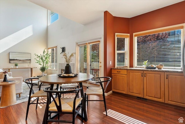 7825 S Spruce Tree Ln, Sandy, UT 84094 - dining room with dark wood finished floors and a skylight