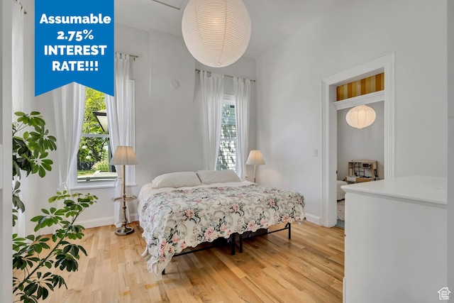 119 E 400 S, Provo, UT 84606 - bedroom featuring multiple windows, baseboards, and light wood-style flooring