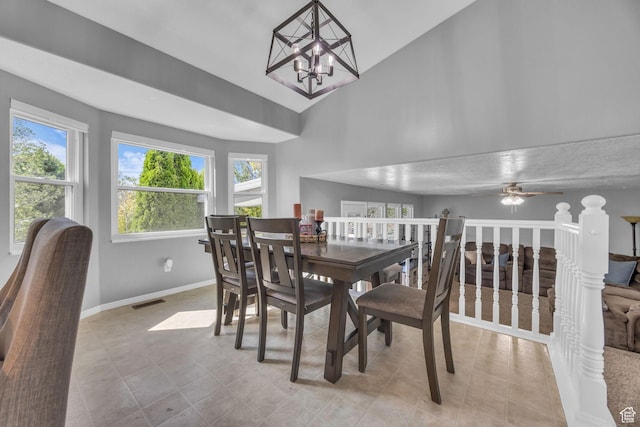 5419 S 4125 W, Roy, UT 84067 - dining space with plenty of natural light, vaulted ceiling, baseboards, a chandelier, and a ceiling fan