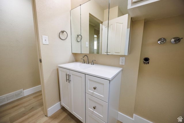 1814 W 80 S, Provo, UT 84601 - bathroom featuring wood finished floors, vanity, and baseboards