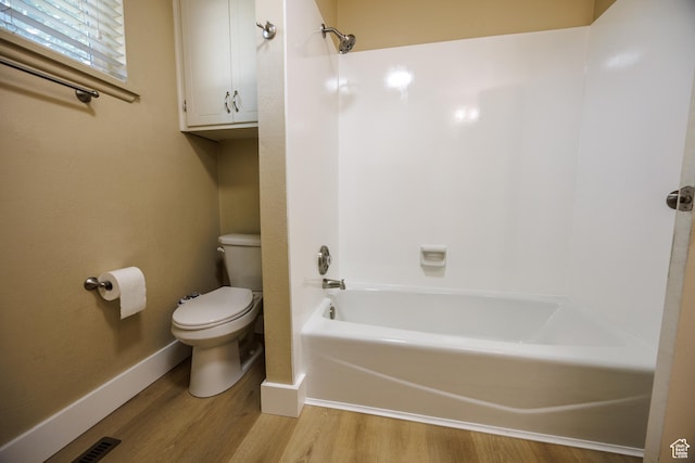 1814 W 80 S, Provo, UT 84601 - bathroom featuring toilet, wood finished floors, baseboards, and shower / washtub combination
