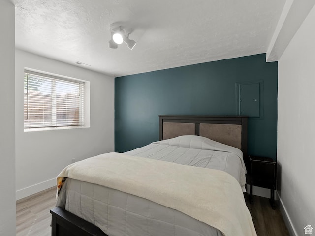 1046 W 370 N, Hyrum, UT 84319 - bedroom featuring wood finished floors, baseboards, and a ceiling fan