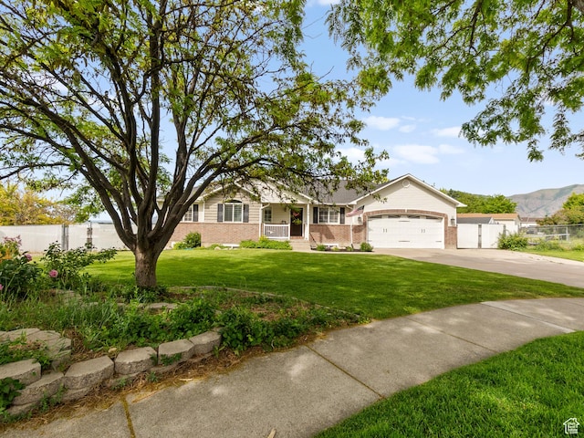 1046 W 370 N, Hyrum, UT 84319 - single story home with brick siding, concrete driveway, a garage, and covered porch