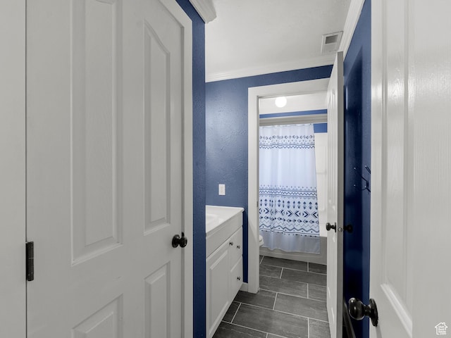 1046 W 370 N, Hyrum, UT 84319 - bathroom with ornamental molding, toilet, curtained shower, a textured wall, and vanity