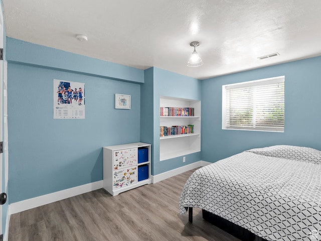 1046 W 370 N, Hyrum, UT 84319 - bedroom featuring wood finished floors and baseboards