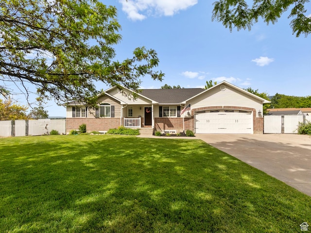 1046 W 370 N, Hyrum, UT 84319 - single story home featuring brick siding, concrete driveway, a garage, and a porch