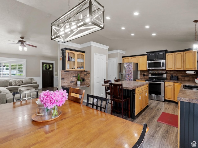 1046 W 370 N, Hyrum, UT 84319 - dining area with a ceiling fan, vaulted ceiling, wood finished floors, and recessed lighting