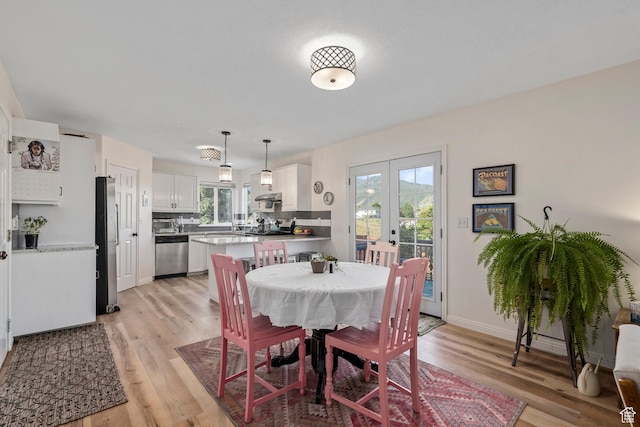 116 S Canyon View Dr, Elk Ridge, UT 84651 - dining area featuring french doors, light wood finished floors, and baseboards