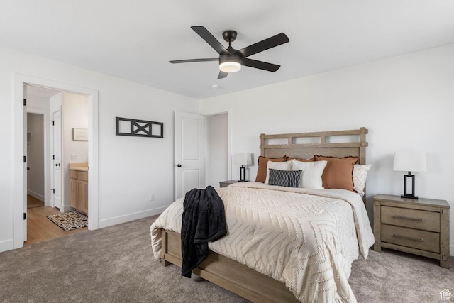 606 W Caroles Way, Tooele, UT 84074 - bedroom with light carpet, baseboards, ensuite bathroom, and ceiling fan