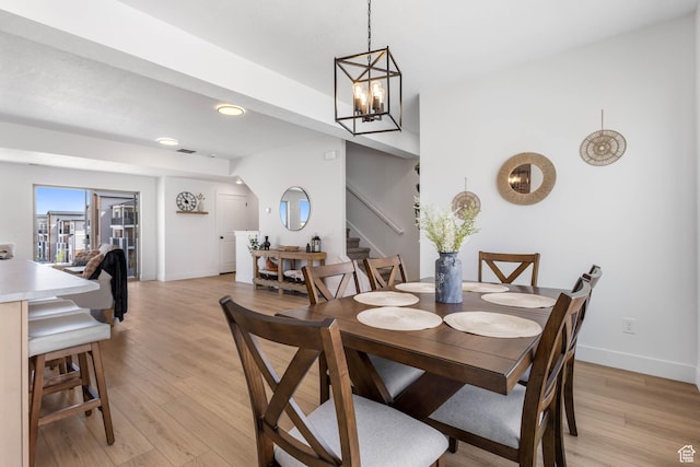 606 W Caroles Way, Tooele, UT 84074 - dining area with stairs, light wood-style flooring, baseboards, recessed lighting, and a chandelier