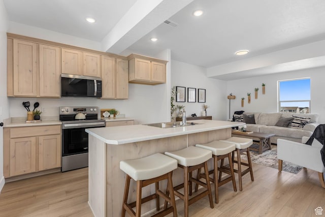 606 W Caroles Way, Tooele, UT 84074 - kitchen featuring stainless steel appliances, light brown cabinets, a sink, and recessed lighting