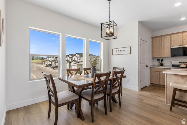 606 W Caroles Way, Tooele, UT 84074 - dining space featuring a chandelier, plenty of natural light, baseboards, and recessed lighting